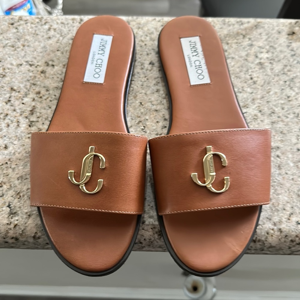 Womens Jimmy Choo Slippers in Size 38 and color dark Tan. Only worn 2 times